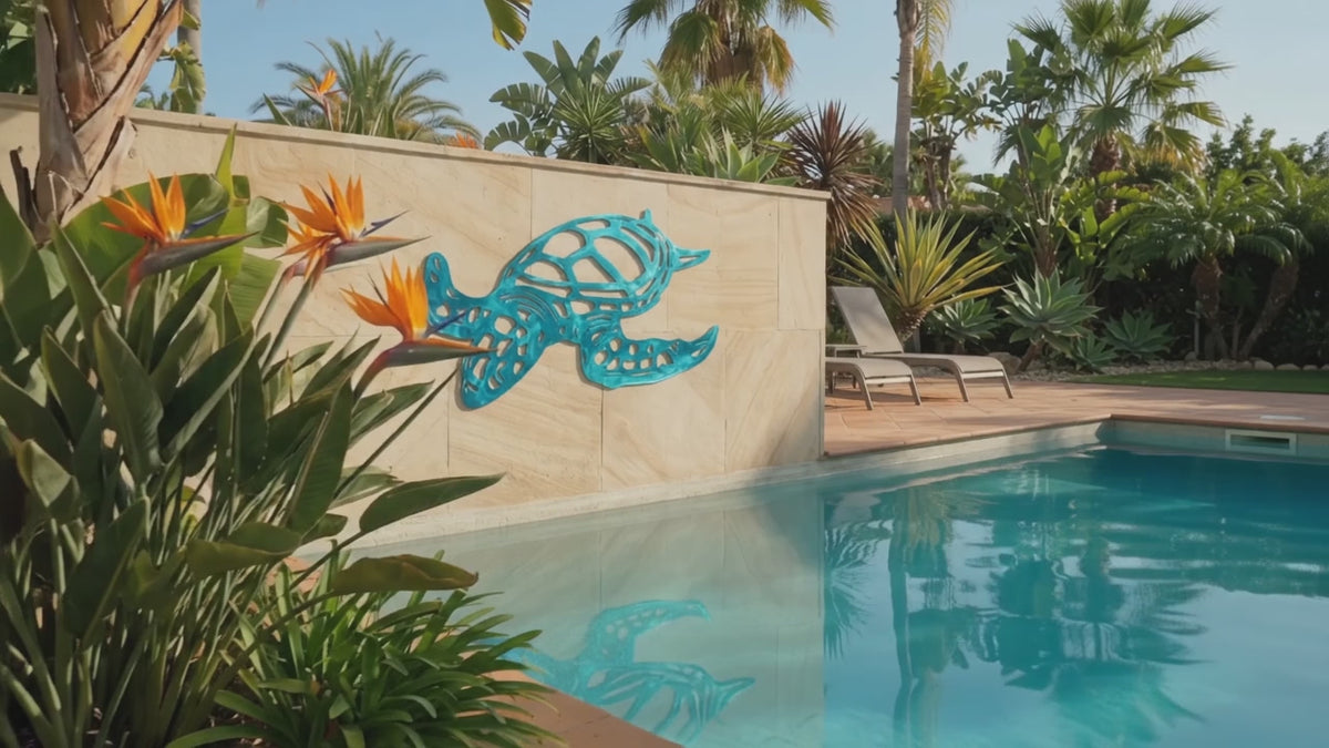 Sea Turtle Metal Wall Art mounted above a pool.